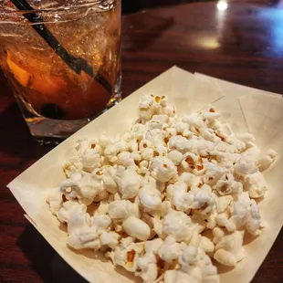 Complimentary popcorn + bourbon old fashioned