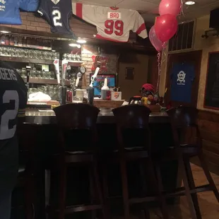 Chairs saved for someone by bar. No place to sit.