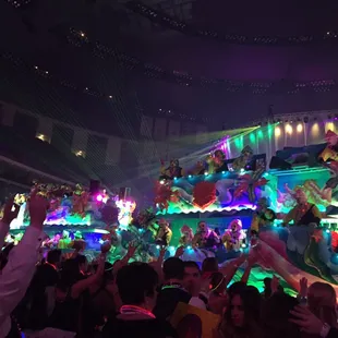 a carnival float in the middle of a crowd