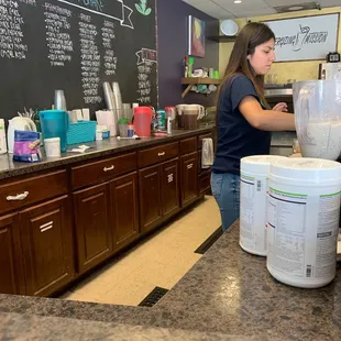 a woman making a smoothie