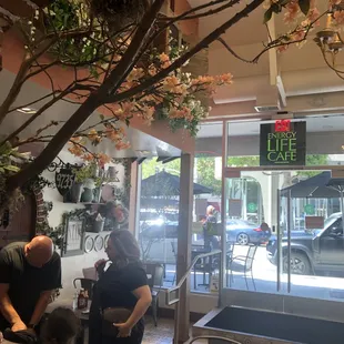 Shady outdoor eating under big umbrellas off the main blvd.