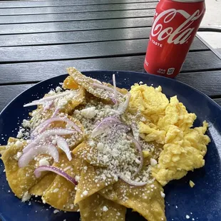 CHILAQUILES.  Green sauce!  Every chip coated but light and crispy!
