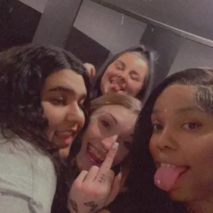 a group of people taking a selfie