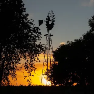 a windmill at sunset
