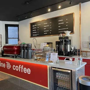 a coffee shop counter with a coffee machine