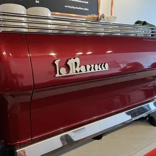 a red espresso machine