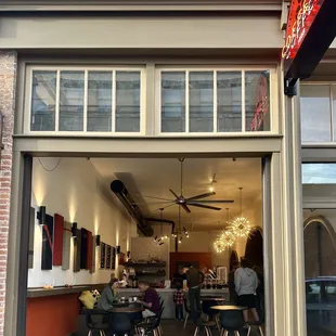 Outside view of the shop with the garage door up