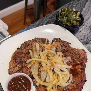  steak with onions and a side of ketchup