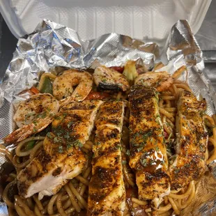 rilled chicken and pasta in a styrofoam container