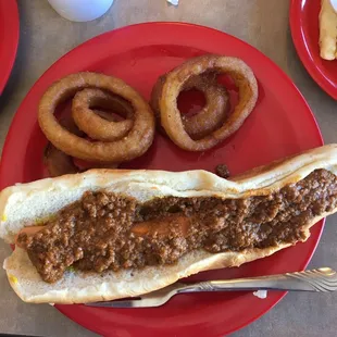 a chili dog and onion rings