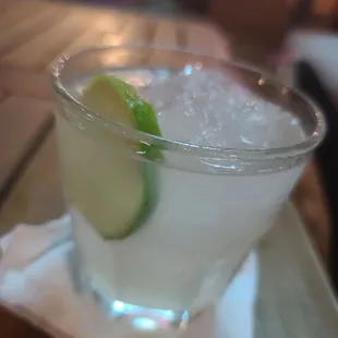 a drink in a glass on a napkin