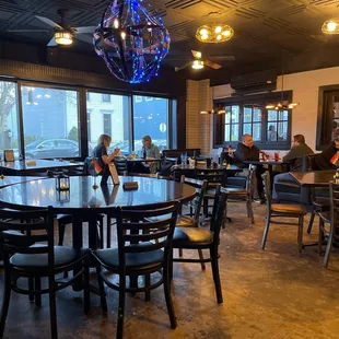 a dining area with tables and chairs
