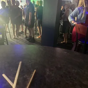 a group of people at a bar