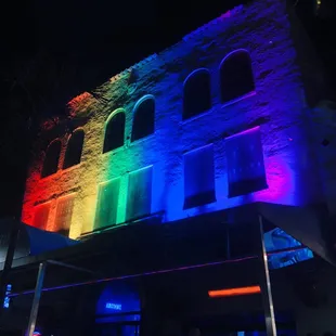 a rainbow lit building