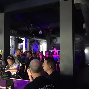 a group of people sitting at a bar