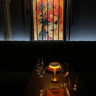 a table with a plate and glasses on it