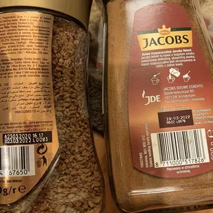 a jar of ground coffee next to a jar of ground coffee