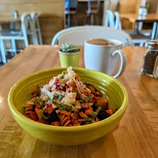 Roma Noodles Brown rice fusilli pasta, chicken, marinara, spinach,  mushrooms, Kalamata olives, parmesan, cilantro pesto drizzle.