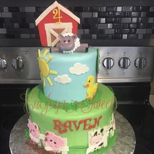a birthday cake with farm animals