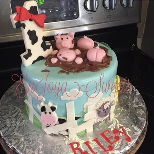 a birthday cake with farm animals