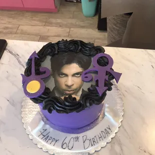 a cake with a picture of prince on it