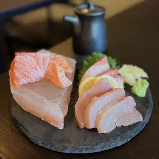 9 pc Sashimi (clockwise): Hamachi, shiro maguro, sake w/ housemade soy sauce  | $23