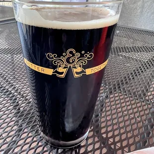 a pint of beer on a table