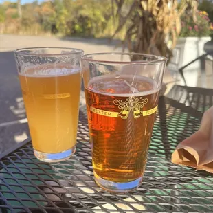 two glasses of beer on a table