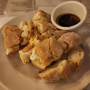 a plate of bread and dipping sauce