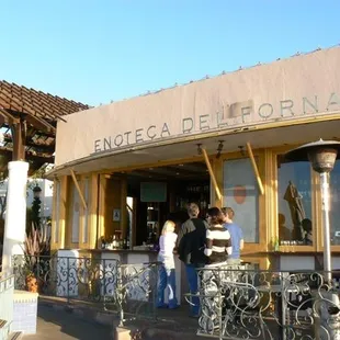 people standing outside a restaurant