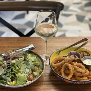 Caesar salad with anchovies, fried calamari rings