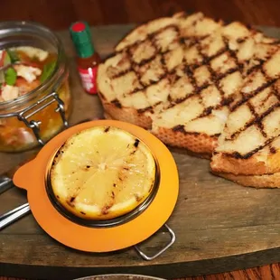 SHRIMP and LOBSTER JAR with shrimp and lobster in garlic herbed butter with green onion and sour dough with sour lemon!