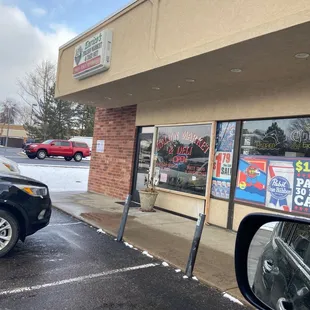 a car parked in front of the store