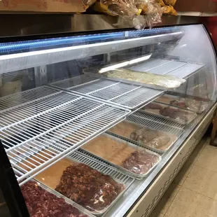 a display case with a variety of pastries