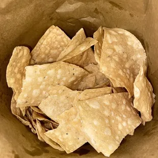 tortilla chips in a paper bag