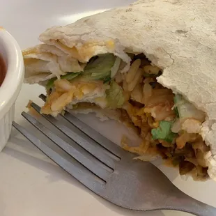 Steak burrito. By hands, no fork or knife.