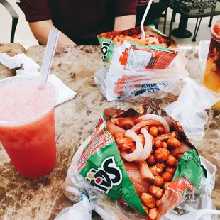 Agua de sandía, pineada (?) and two tostilocos