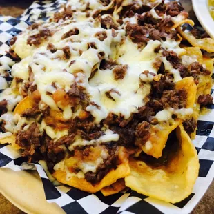 Newly added item on the menu! Carne Asada nachos!  Chips, beans, tasty green sauce, and melted cheese!!!  Delicious!!!!