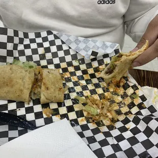 a person eating a burrito