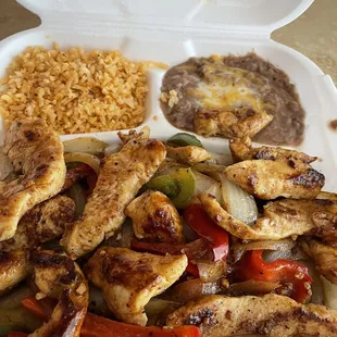 chicken and rice in a styrofoam container