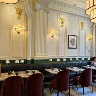 a woman sitting at a table in a restaurant