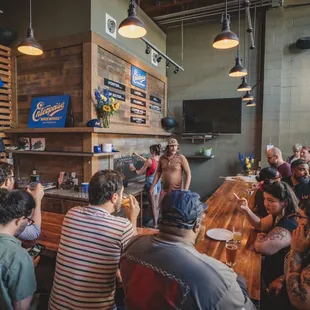 a group of people sitting at a bar