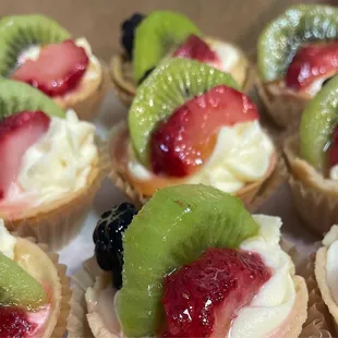 a variety of fruit tarts
