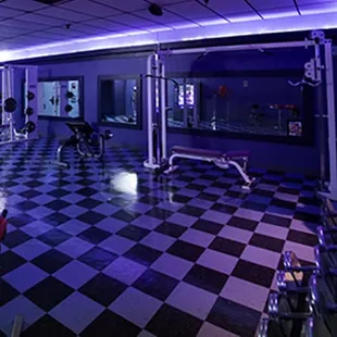 a checkerboard floor with neon lights