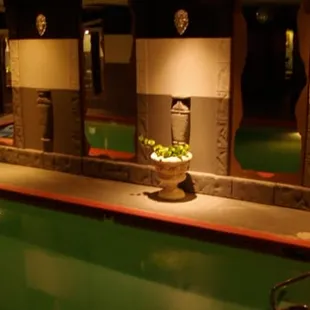 a pool and spa area at night