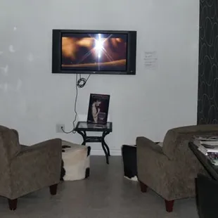 a living room with a flat screen tv