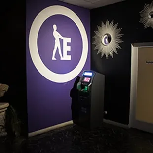 an atm machine in a dark room