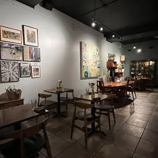 a dining area with tables and chairs