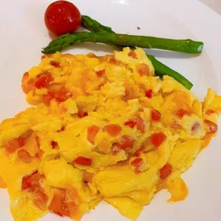 Scrambled eggs with tomatoes and  cheese