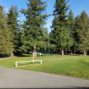 a picnic table in the middle of a golf course